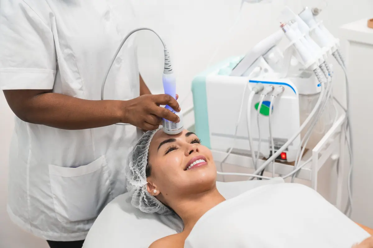 Beautician using professional facial equipment at Inga's Secrets Aesthetics Northampton