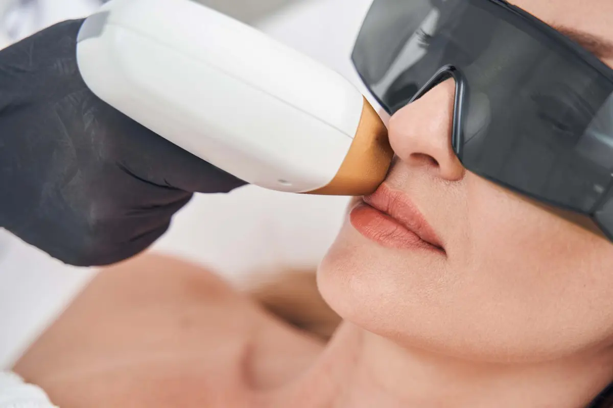 Client relaxing during an IPL laser facial treatment in Northampton