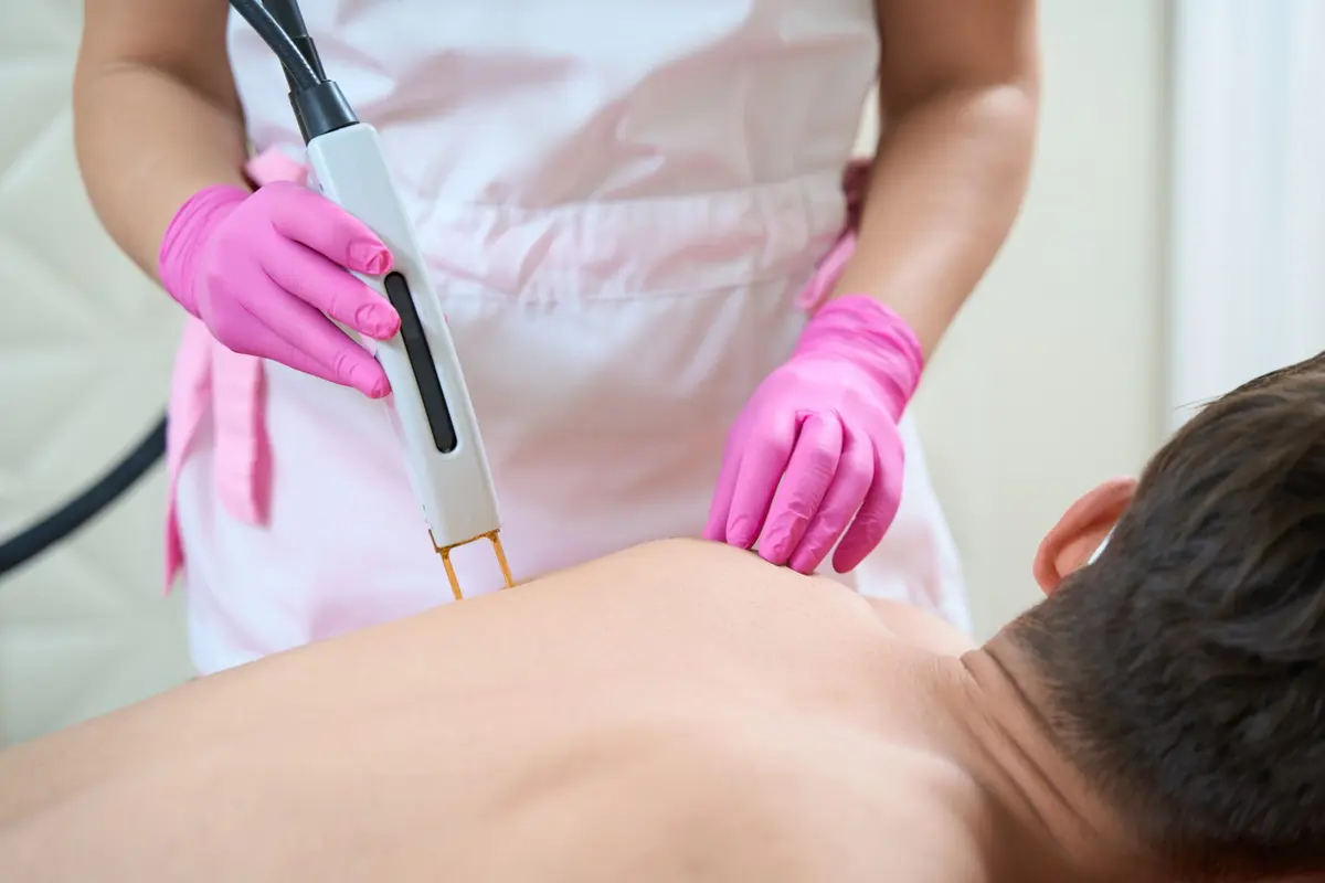 Practitioner performing laser hair removal at Inga's Secrets Aesthetics Northampton