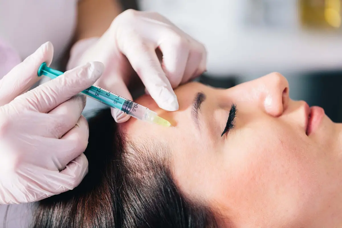 Injectable tissue stimulator treatment on a woman's face at Inga's Secrets Aesthetics Northampton